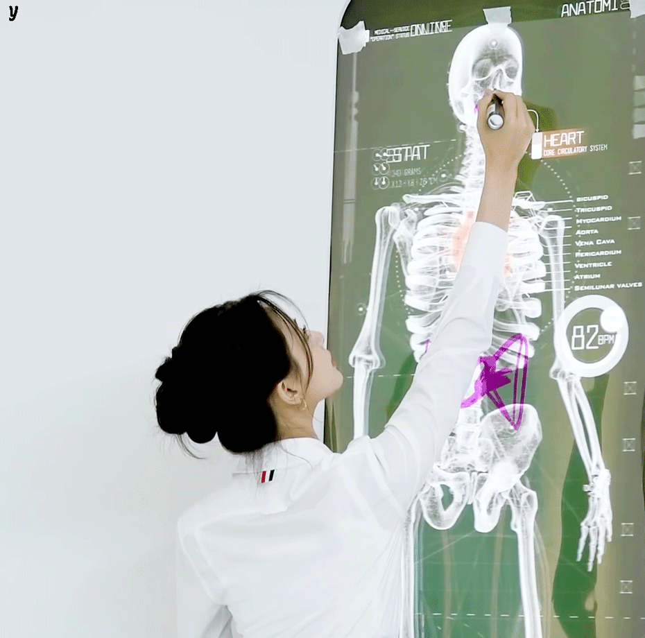 Girl drawing on an x-ray skeleton (1).gif