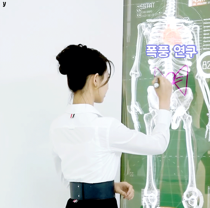 Girl drawing on an x-ray skeleton (2).gif