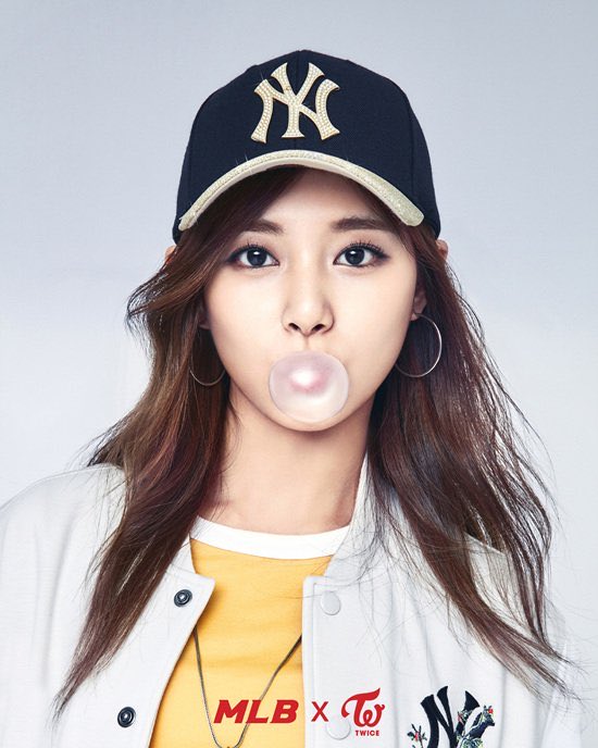 Girl-Chewing-Bubble-Gums-and-wearing-New-York-Yankees-Hat.jpg